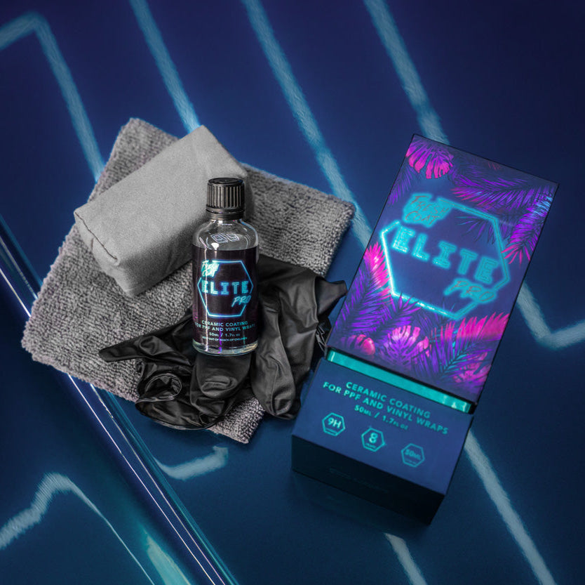 Car care products including a bottle and packaging on a car surface with neon lights in the background.