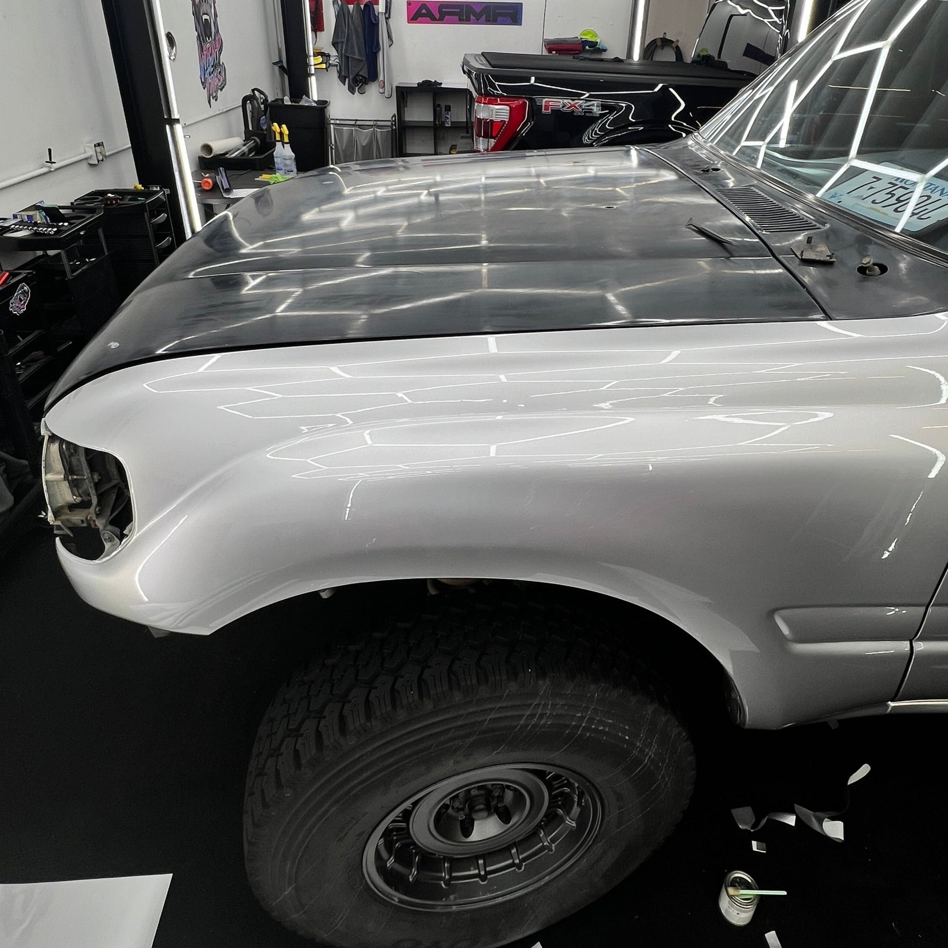 Picture of a Land Cruiser partially wrapped in ARMR Hyper Silver